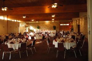 view of banquet hall with tables and chairs